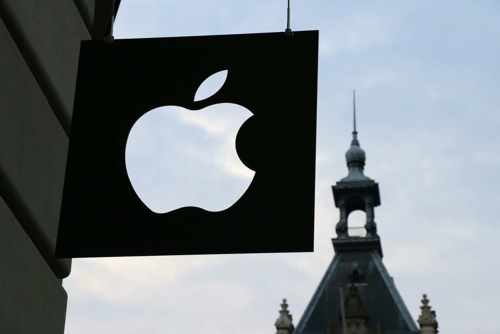 Photo by Medhat Dawoud Apple logo in front of a building